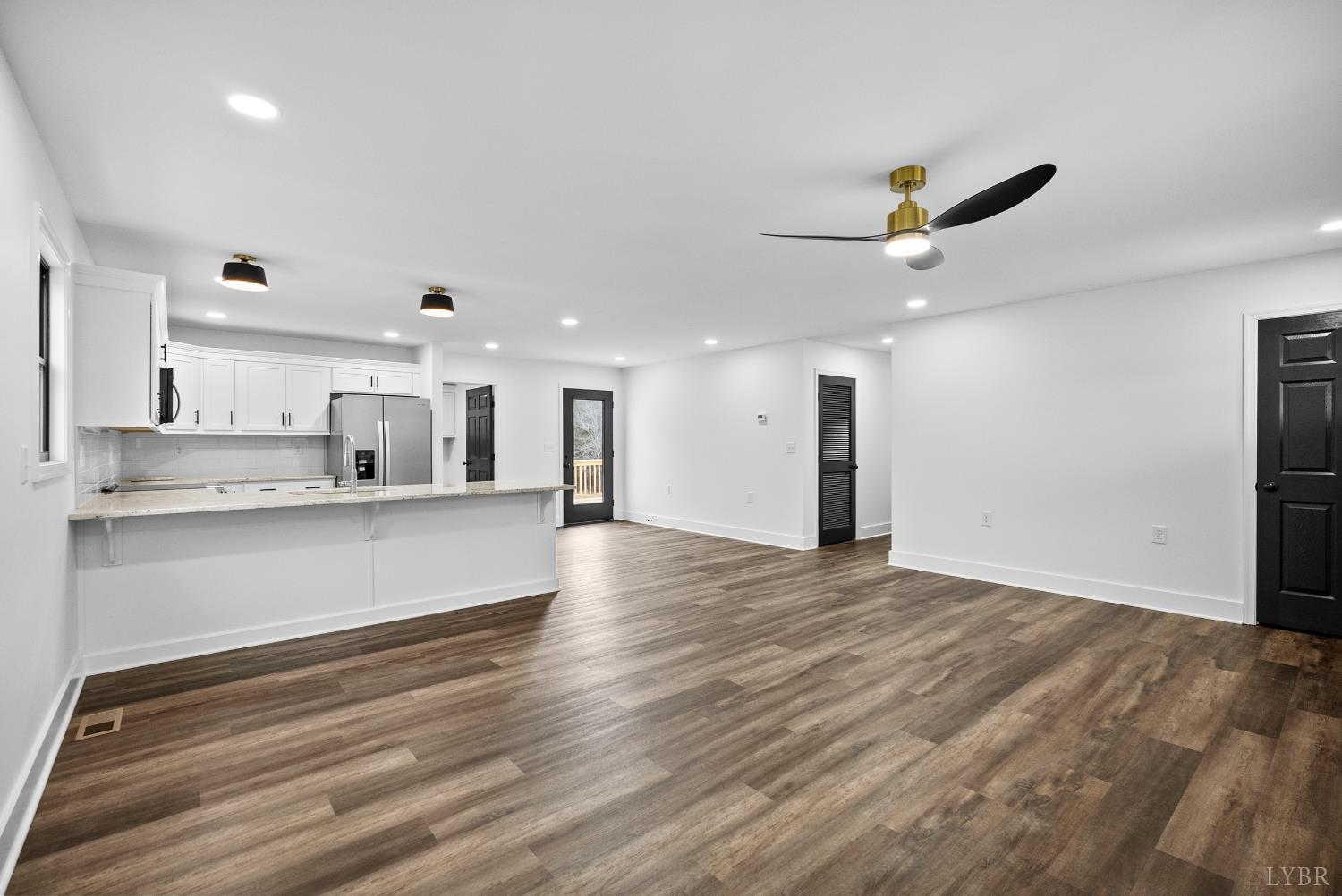 112 Savage Drive Rustburg, VA 24588 - Photo 8 of 51 a view of large kitchen with stainless steel appliances cabinets and wooden floor