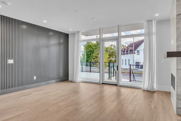 a bedroom with a large bed and a potted plant