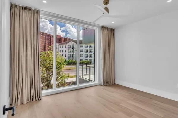 a bathroom with a bathtub shower sink vanity and toilet
