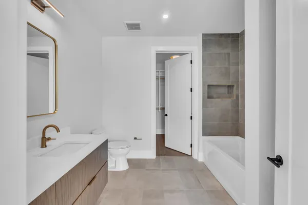 a view of a patio with couches and a fire pit