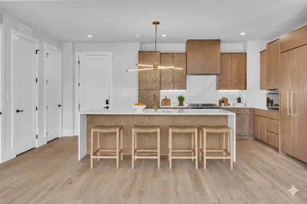 a kitchen with a table and chairs in it