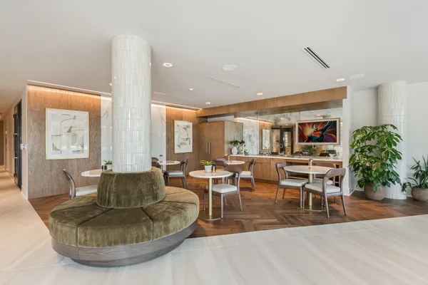 a large kitchen with stainless steel appliances kitchen island granite countertop a sink and cabinets