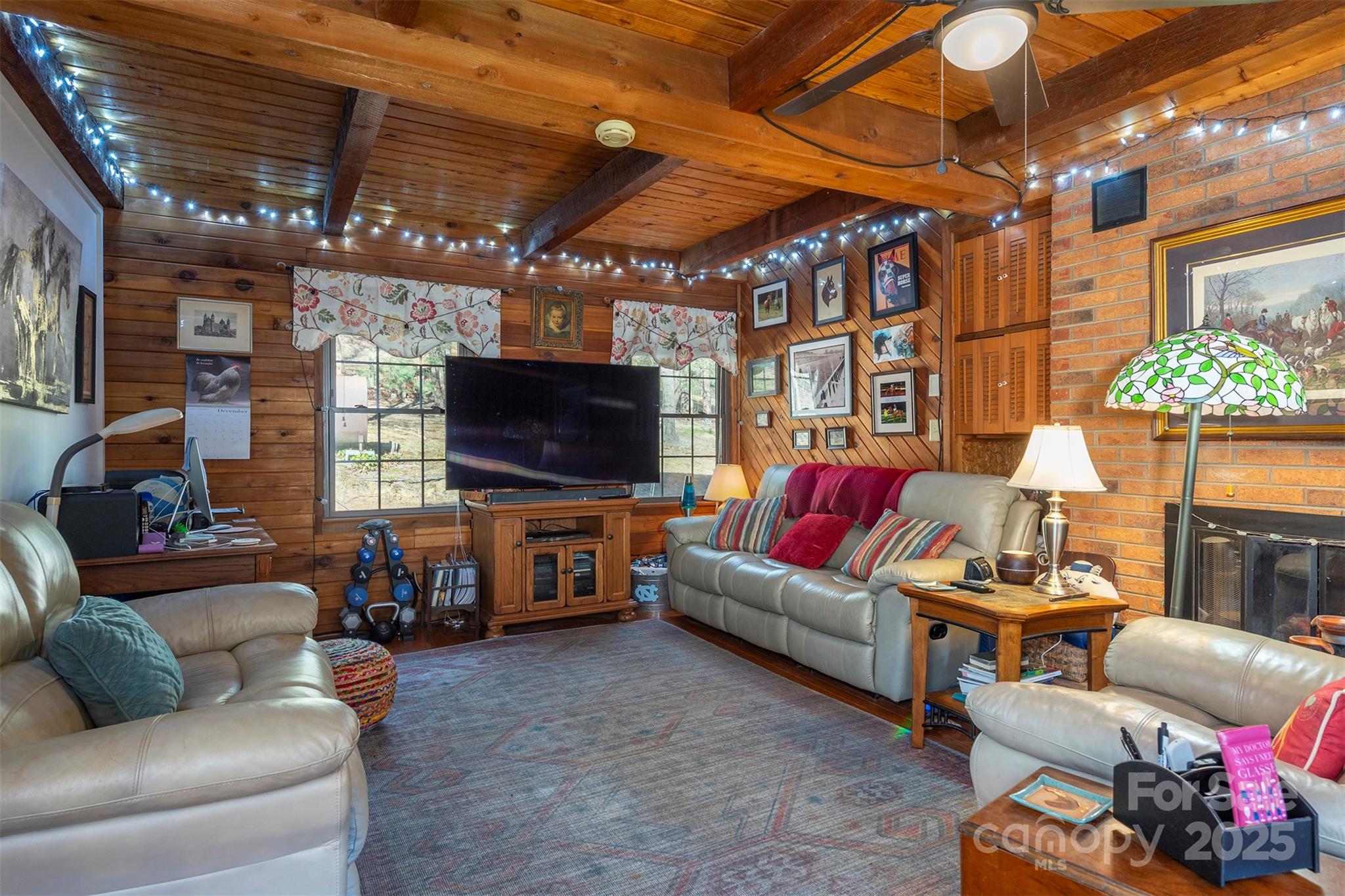 366 Dix Creek Road 2 Road, Unit 2 Leicester, NC 28748 - Photo 11 of 48 a living room with furniture and a flat screen tv