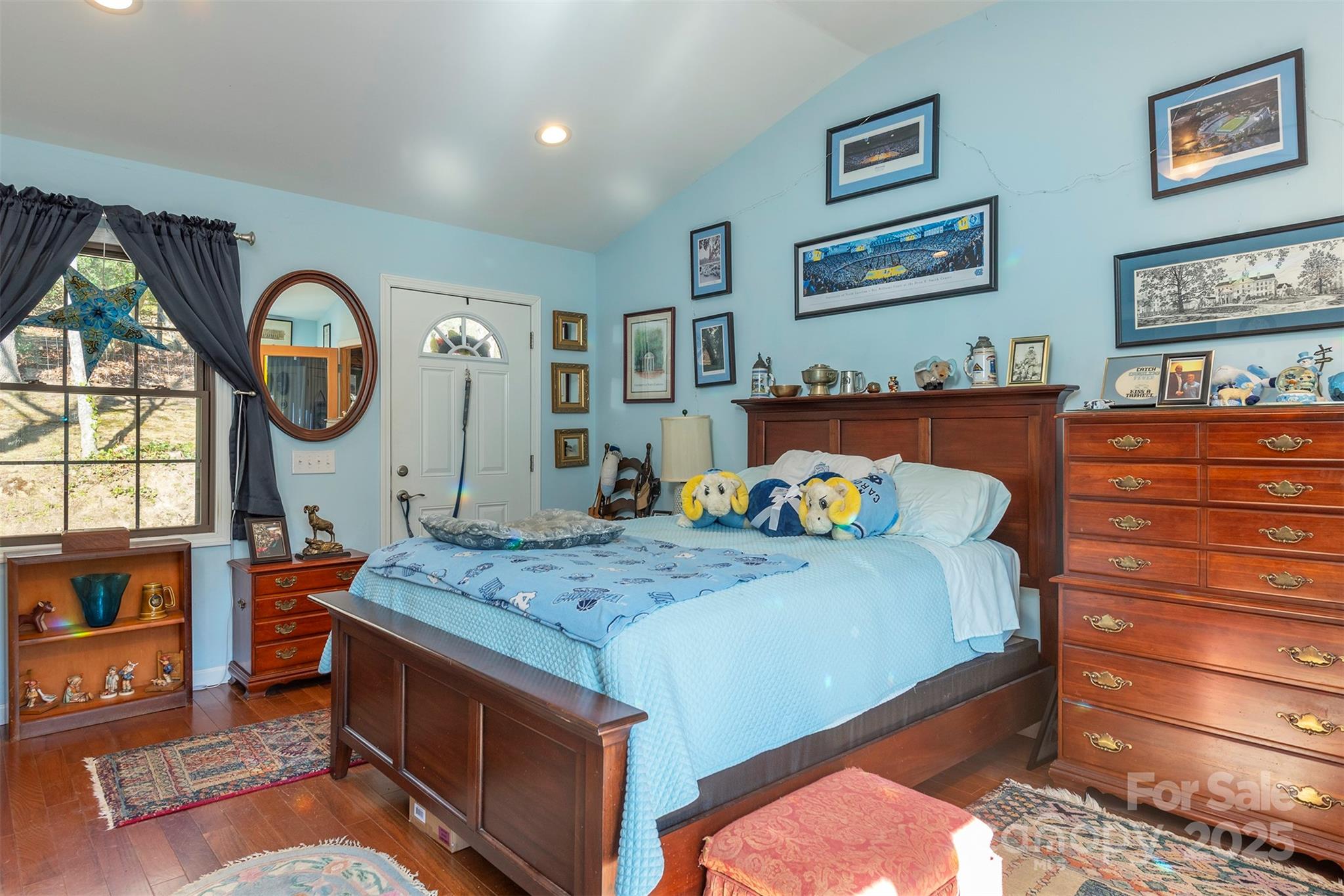 366 Dix Creek Road 2 Road, Unit 2 Leicester, NC 28748 - Photo 16 of 48 a bedroom with a bed a dresser and paintings on the wall