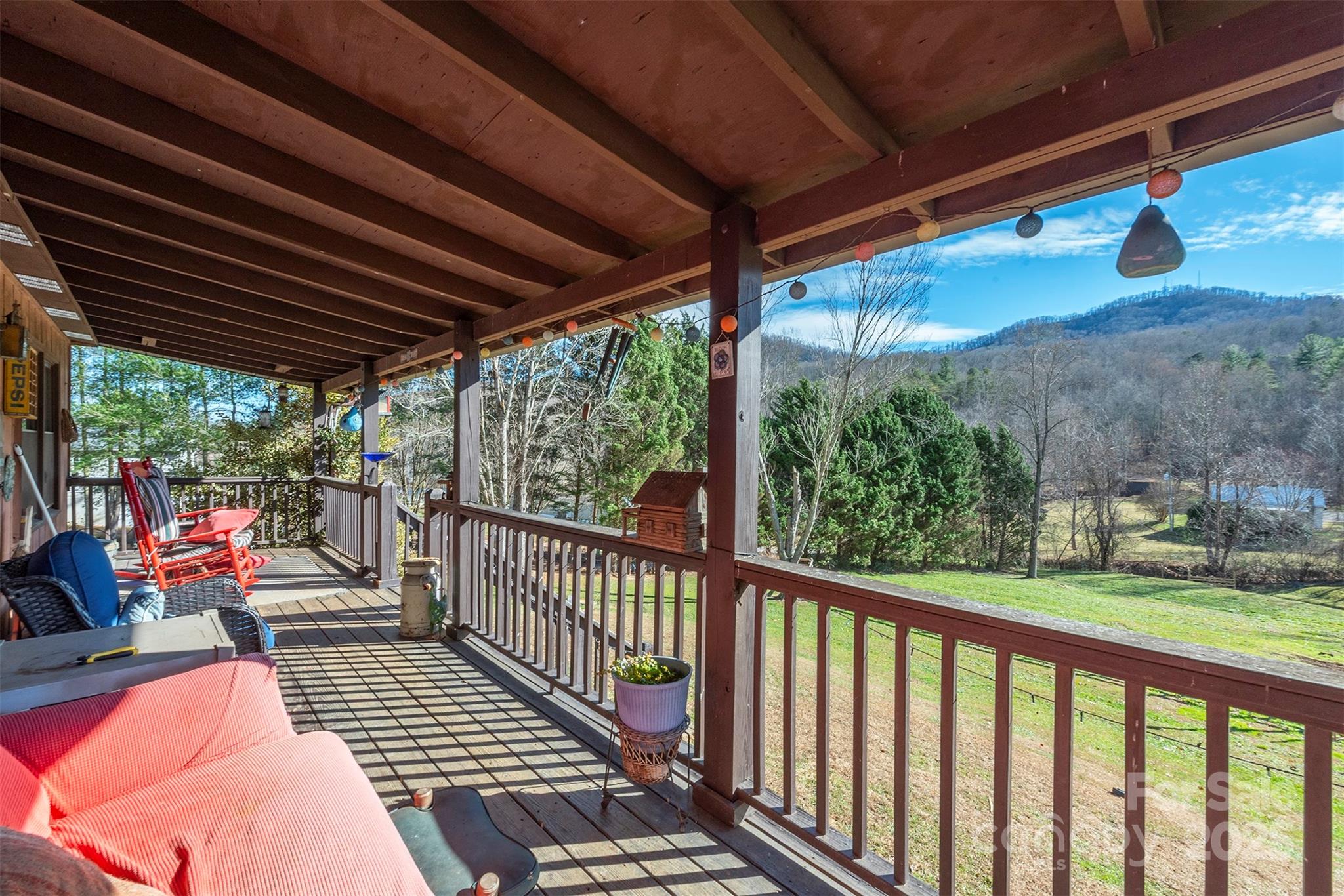 366 Dix Creek Road 2 Road, Unit 2 Leicester, NC 28748 - Photo 39 of 48 a view of balcony with couch and wooden floor