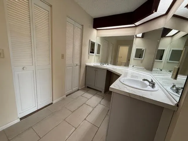 a bathroom with a sink and mirror