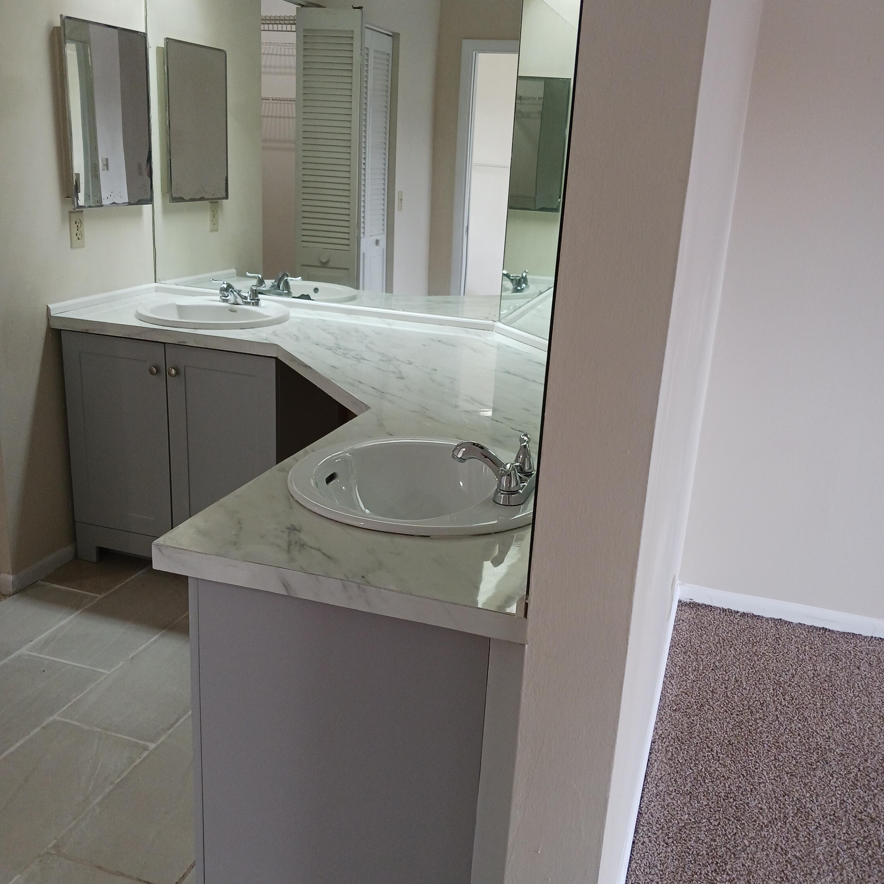 6533 Sweet Maple Lane Boca Raton, FL 33433 - Photo 13 of 20 a bathroom with a sink and mirror