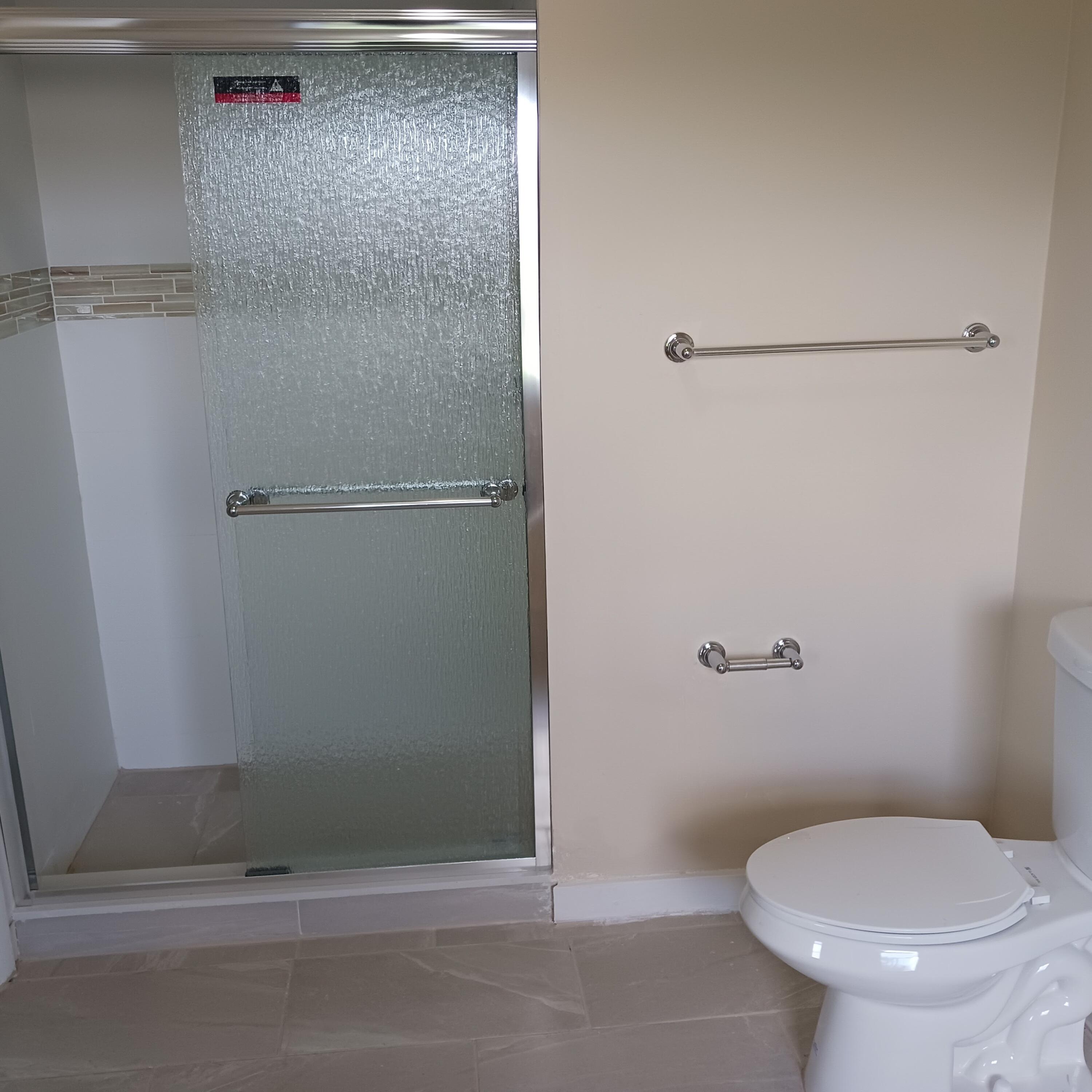 6533 Sweet Maple Lane Boca Raton, FL 33433 - Photo 16 of 20 a bathroom with a toilet and a shower