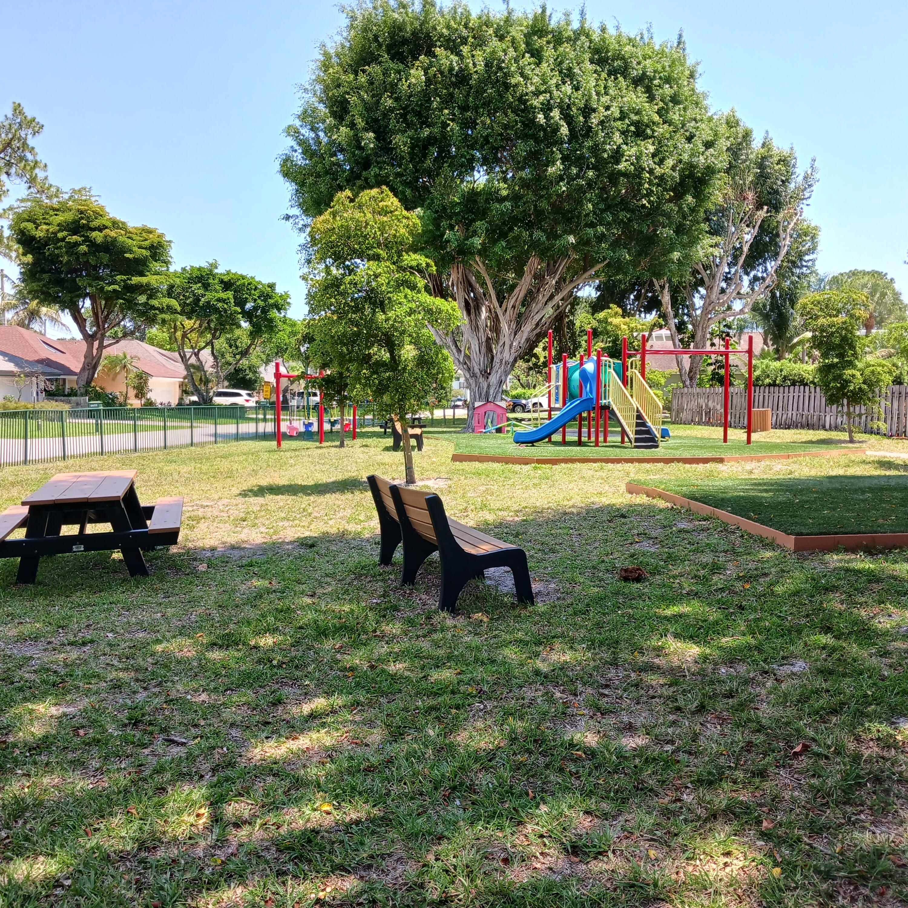 6533 Sweet Maple Lane Boca Raton, FL 33433 - Photo 20 of 20 a view of a park with slide and bench