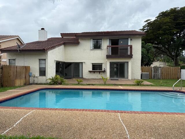 6533 Sweet Maple Lane Boca Raton, FL 33433 - Photo 2 of 20 a front view of a house with swimming pool