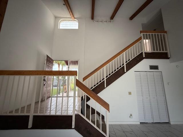 6533 Sweet Maple Lane Boca Raton, FL 33433 - Photo 8 of 20 a view of staircase with wooden floor and white walls