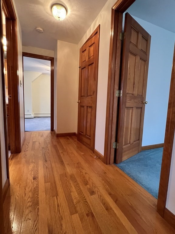 68 Deer Run Circle Barre, MA 01005 - Photo 15 of 26 a view of a hallway with wooden floor
