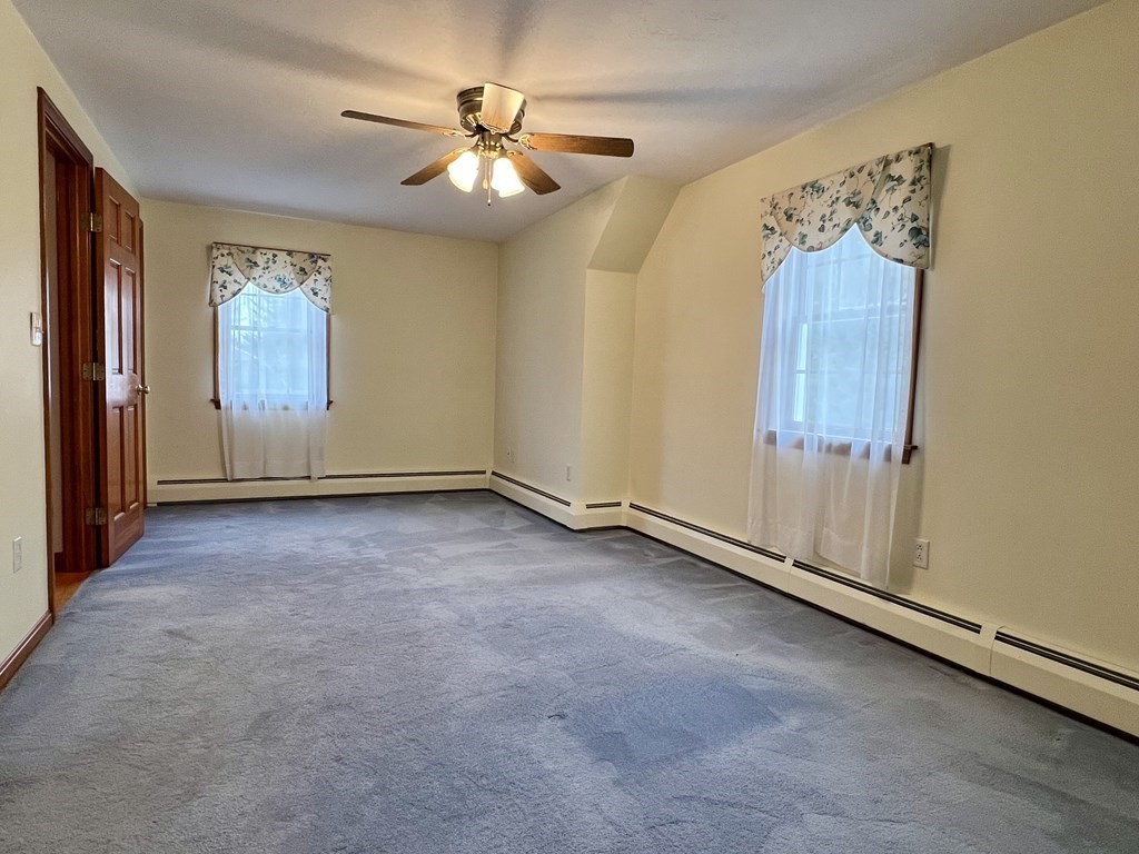 68 Deer Run Circle Barre, MA 01005 - Photo 16 of 26 an empty room with windows and fan