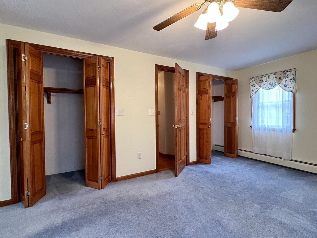 68 Deer Run Circle Barre, MA 01005 - Photo 18 of 26 an empty room with windows and closet