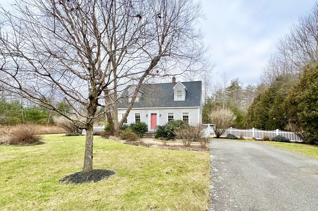 68 Deer Run Circle Barre, MA 01005 - Photo 2 of 26 a front view of house with yard and trees around
