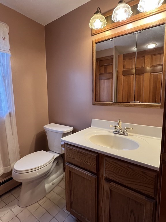 68 Deer Run Circle Barre, MA 01005 - Photo 22 of 26 a bathroom with a sink a toilet and mirror