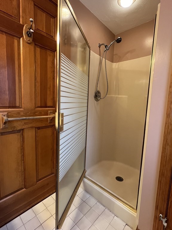68 Deer Run Circle Barre, MA 01005 - Photo 23 of 26 a bathroom with a glass door shower and a sink