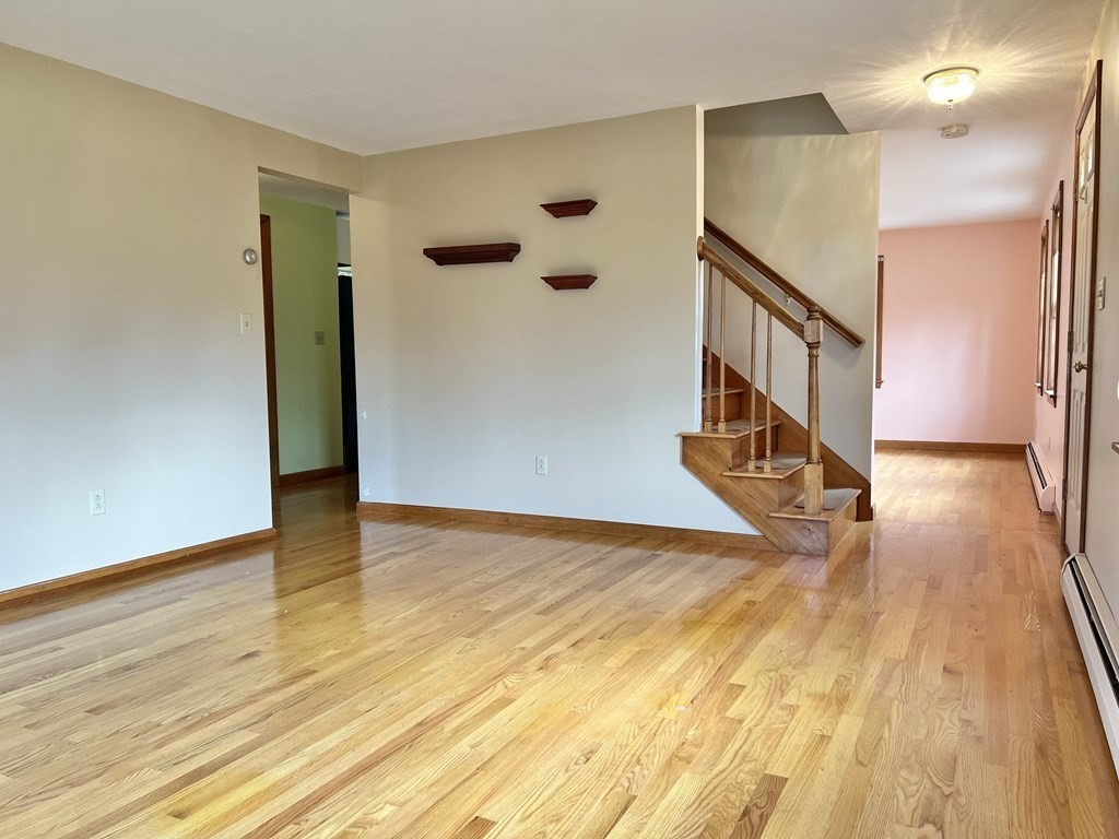 68 Deer Run Circle Barre, MA 01005 - Photo 8 of 26 a view of a hallway with wooden floor