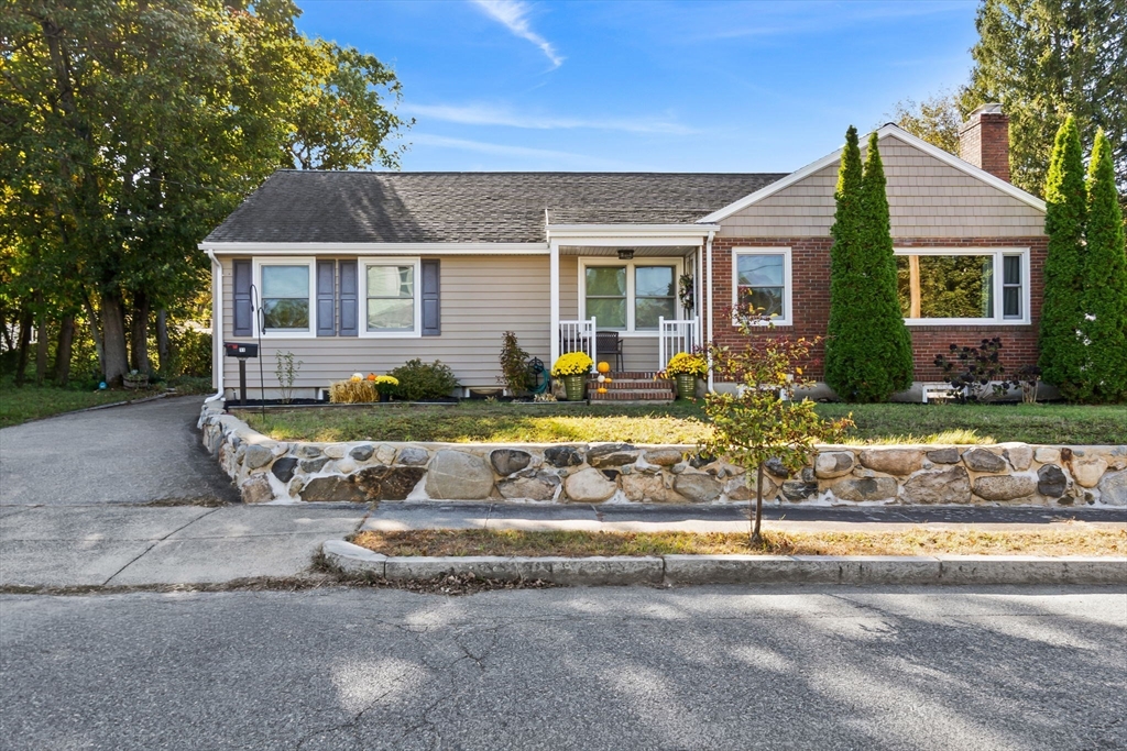 11 Wilson Avenue Wakefield, MA 01880 - Photo 2 of 42 a front view of a house with a yard outdoor seating and covered with trees