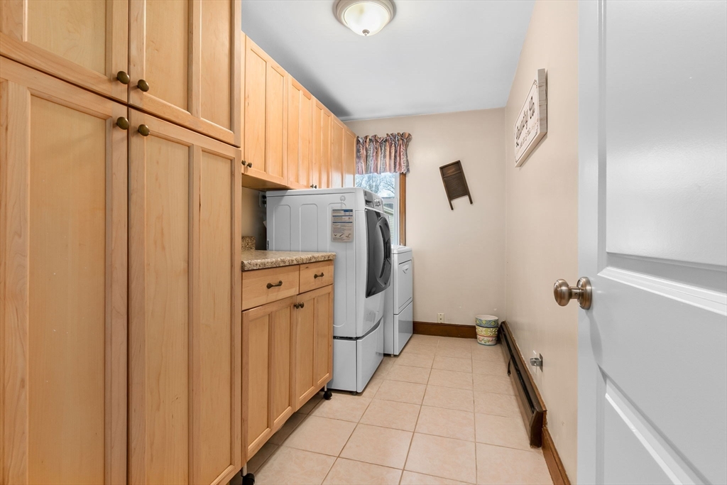 11 Wilson Avenue Wakefield, MA 01880 - Photo 22 of 42 a bathroom with a sink a toilet and shower
