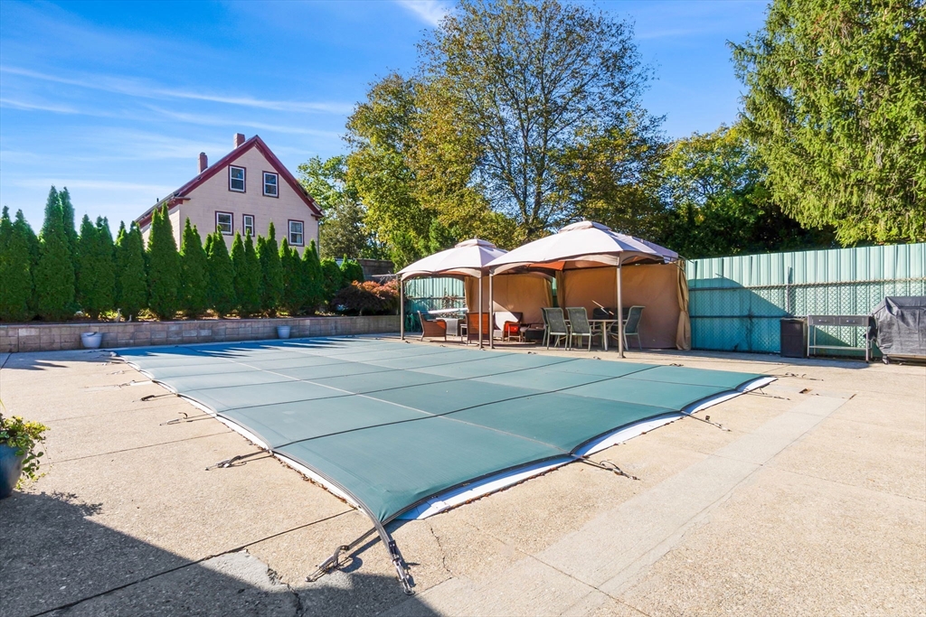 11 Wilson Avenue Wakefield, MA 01880 - Photo 36 of 42 a front view of a house with yard and trees