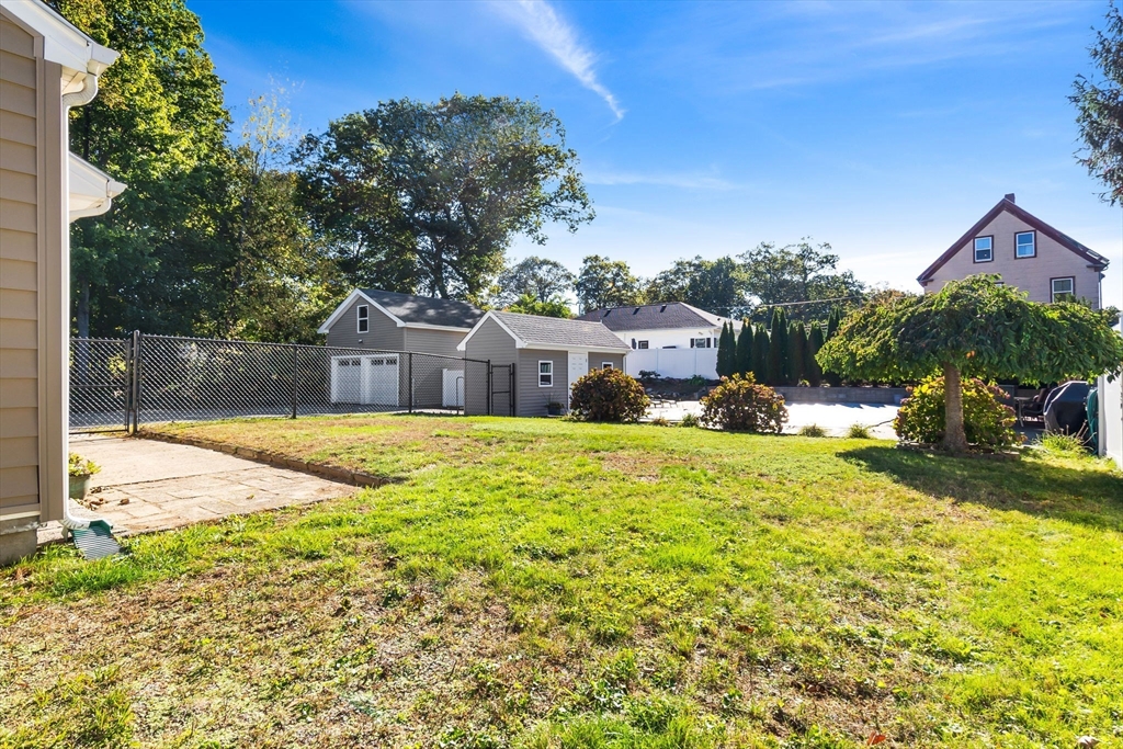 11 Wilson Avenue Wakefield, MA 01880 - Photo 39 of 42 a swimming pool with outdoor seating and yard