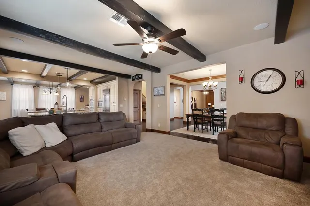 a living room with furniture and a clock
