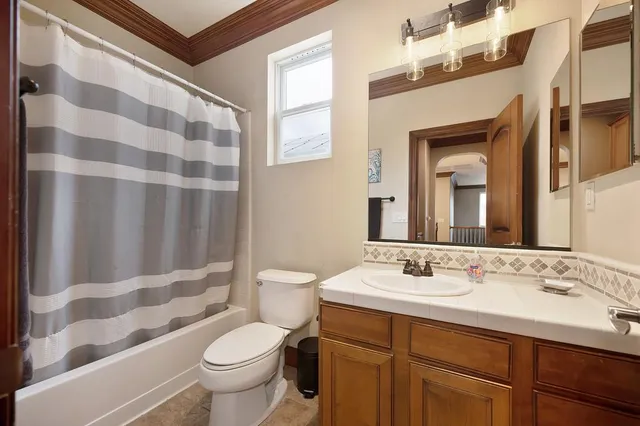 a bathroom with a sink and toilet