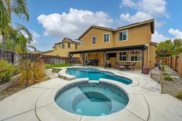 a view of a house with swimming pool