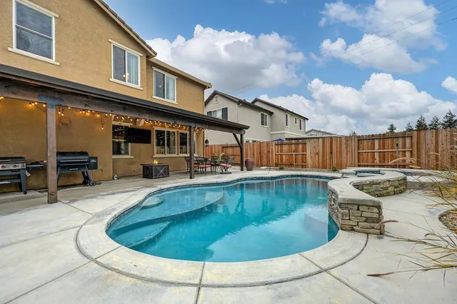 a view of a house with swimming pool