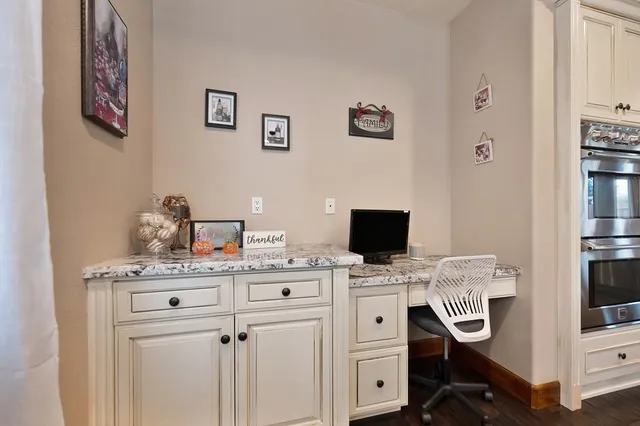 a view of a workspace with furniture