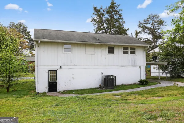 a backyard of a house with lots of green space