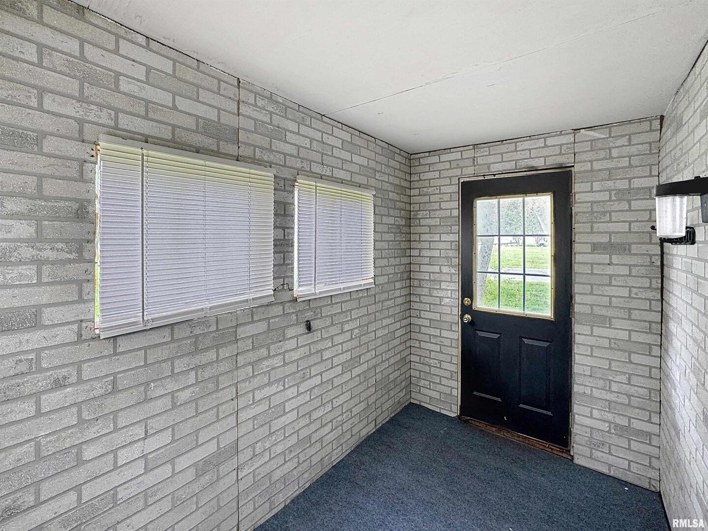 204 Main Avenue Matherville, IL 61263 - Photo 5 of 27 a view of an empty room with a window