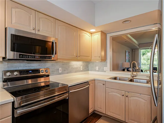 a bedroom with a bed a mirror and a window