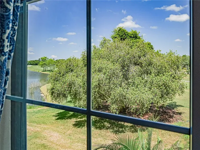 a livingroom with workspace couch and a window