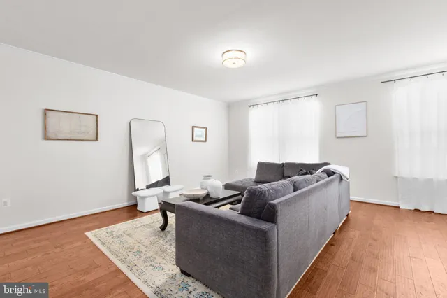 a living room with furniture and a rug