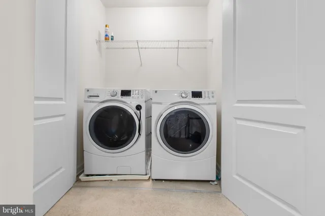 a bathroom with a double vanity sink mirror double and bathtub