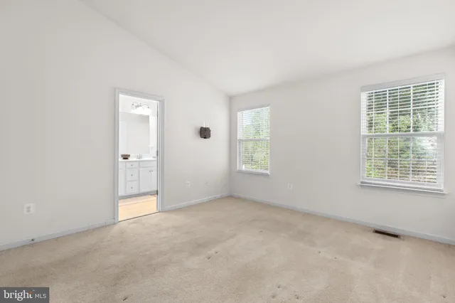 a bathroom with a shower and a glass door