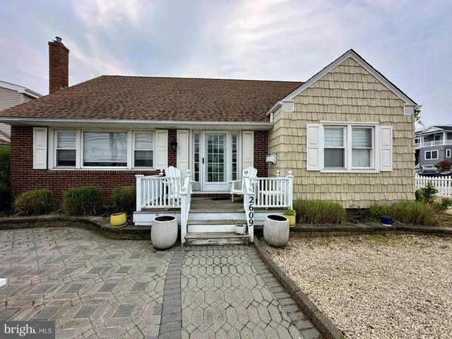 a front view of a house with barbeque oven