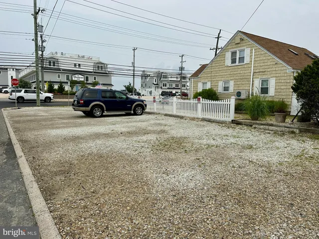 a view of a car parked in front of a building