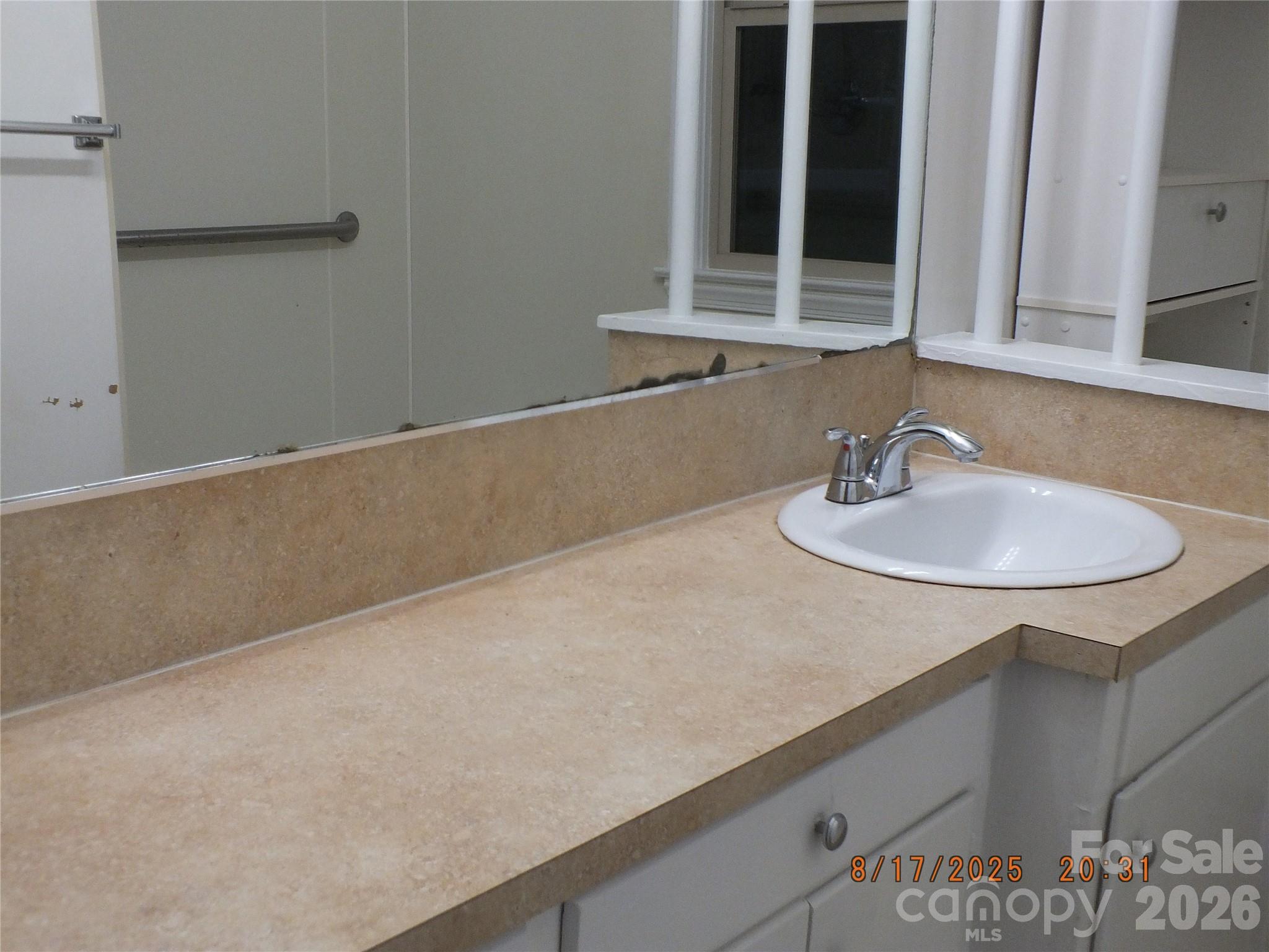 414 West Springs Street Lancaster, SC 29720 - Photo 14 of 22 a bathroom with a sink and a mirror