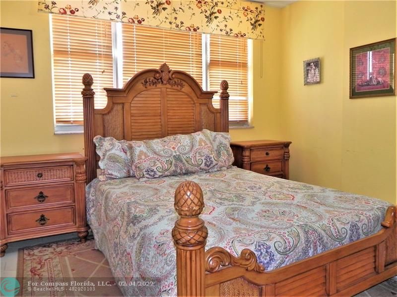 4350 Hillcrest Drive, Unit 212 Hollywood, FL 33021 - Photo 17 of 38 a bedroom with a bed and a window
