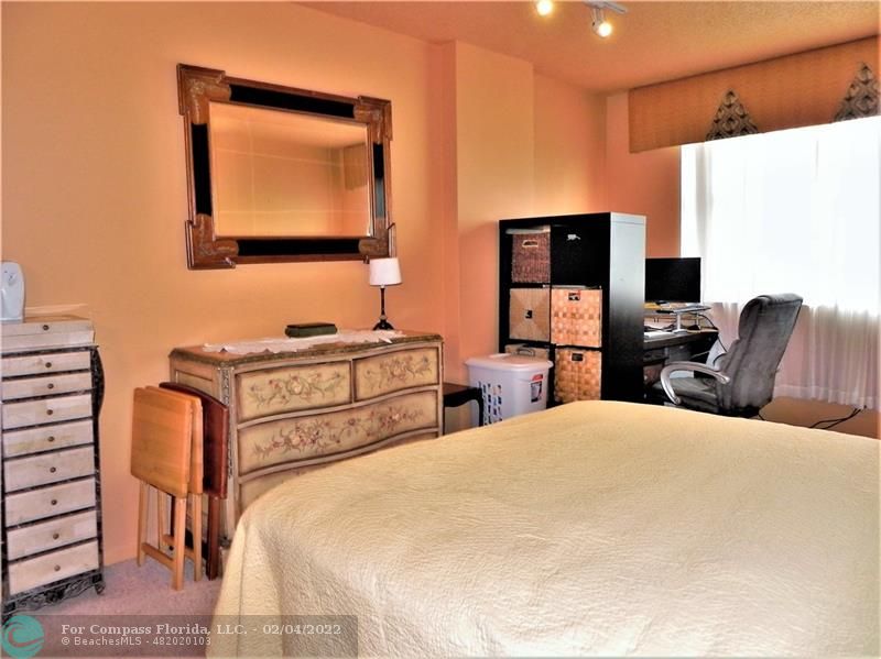 4350 Hillcrest Drive, Unit 212 Hollywood, FL 33021 - Photo 23 of 38 a bedroom with a bed and a flat screen tv