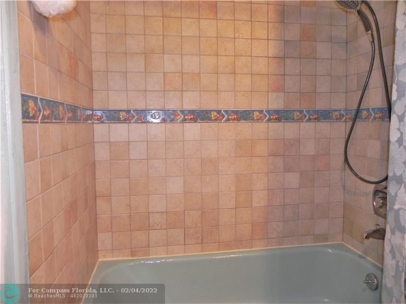 4350 Hillcrest Drive, Unit 212 Hollywood, FL 33021 - Photo 27 of 38 a bathroom with a shower