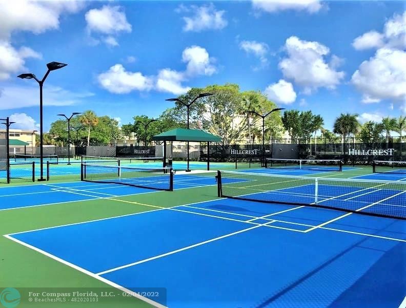 4350 Hillcrest Drive, Unit 212 Hollywood, FL 33021 - Photo 37 of 38 a view of an outdoor space and tennis court