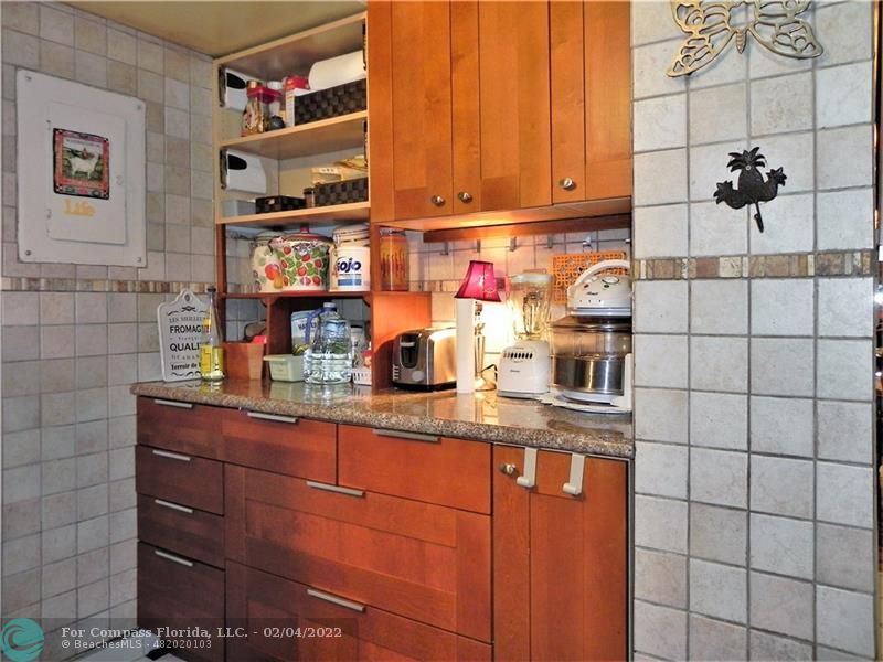 4350 Hillcrest Drive, Unit 212 Hollywood, FL 33021 - Photo 8 of 38 a kitchen with stainless steel appliances granite countertop a sink and cabinets