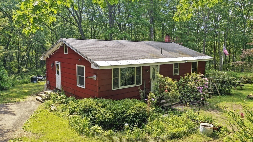 9 Number 6 Road Leverett, MA 01054 - Photo 1 of 26 a aerial view of a house next to a yard