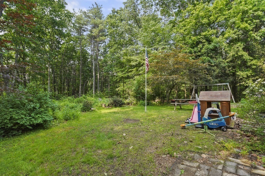 9 Number 6 Road Leverett, MA 01054 - Photo 16 of 26 a backyard of a house with table and chairs