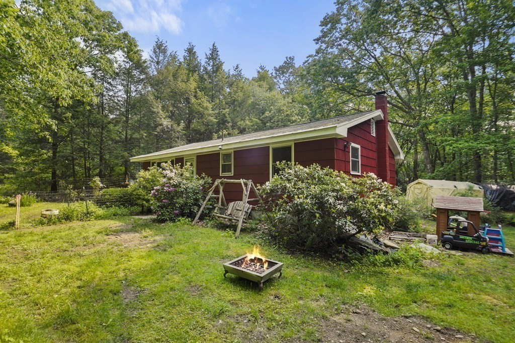 9 Number 6 Road Leverett, MA 01054 - Photo 18 of 26 a front view of a house with garden
