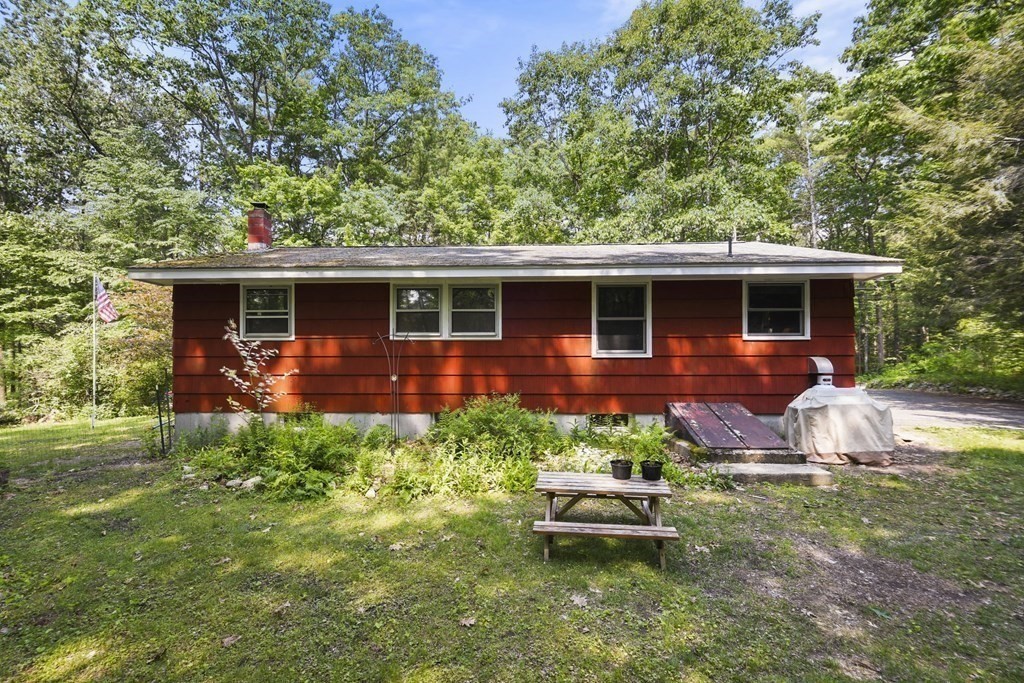 9 Number 6 Road Leverett, MA 01054 - Photo 19 of 26 a front view of house with yard and outdoor seating
